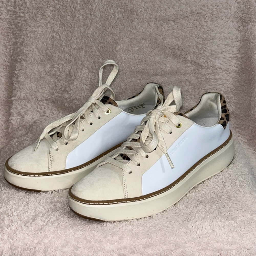 Cole Haan Grand pro Top Spin sneaker with leopard heel accent.